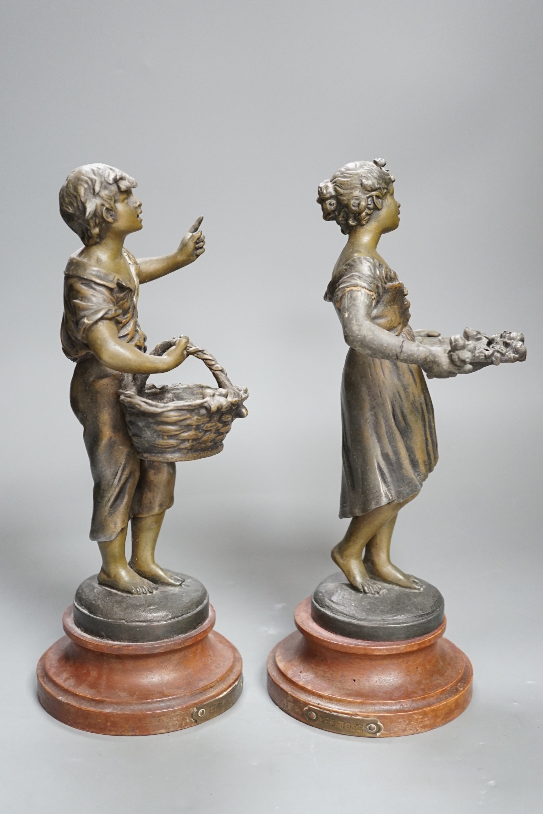 A pair of French spelter figures ‘Les Cerises’ and ‘Les Roses’. 29cm tall.